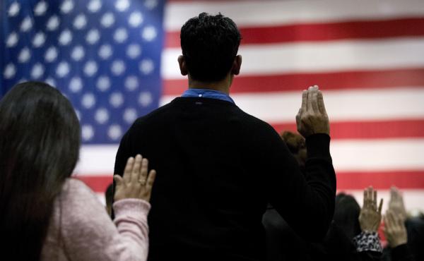 People take the oath of allegiance to become U.S. citizens during a naturalization ceremony at the Los Angeles Convention Center in 2017. People take the oath of allegiance to become U.S. citizens during a naturalization ceremony at the Los Angeles Convention Center in 2017.