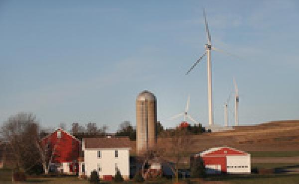Wind turbines twirl above farmland on the outskirts of Madison, Wis. Not all locals are pleased. Wind turbines twirl above farmland on the outskirts of Madison, Wis. Not all locals are pleased.