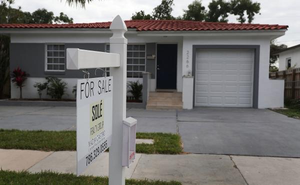 A "for sale" sign is seen in front of a home in Miami on Jan. 24, 2018. The partial shutdown of the federal government is causing some financial problems for furloughed workers who can't refinance their mortgages or buy homes because lenders can't verify A "for sale" sign is seen in front of a home in Miami on Jan. 24, 2018. The partial shutdown of the federal government is causing some financial problems for furloughed workers who can't refinance their mortgages or buy homes because lenders can't verify