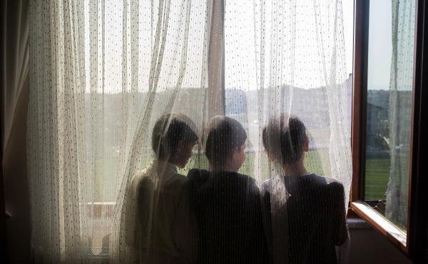 Ten-year-old Nurzat (right) and his friends, brothers Abdulla (left), 11, and Muhammet (center), 10, look out the window of their dormitory room at a boarding school in Istanbul, Turkey. The boys are all missing their parents, who are believed to be in pr Ten-year-old Nurzat (right) and his friends, brothers Abdulla (left), 11, and Muhammet (center), 10, look out the window of their dormitory room at a boarding school in Istanbul, Turkey. The boys are all missing their parents, who are believed to be in pr