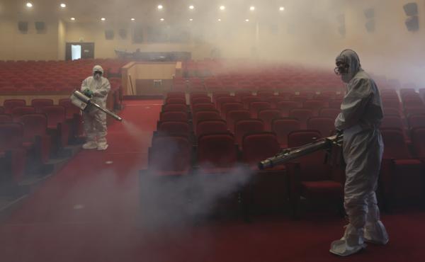 Workers wearing protective suits fumigate an art hall with antiseptic solution as a precaution against the spread of the Middle East respiratory syndrome in Seoul, South Korea, in June 2015. Workers wearing protective suits fumigate an art hall with antiseptic solution as a precaution against the spread of the Middle East respiratory syndrome in Seoul, South Korea, in June 2015.