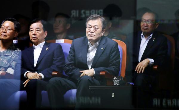 South Korean President Moon Jae-in watches a test-firing of an indigenously developed ballistic missile at the state-run Agency for Defense Development in Taean, South Korea. South Korean President Moon Jae-in watches a test-firing of an indigenously developed ballistic missile at the state-run Agency for Defense Development in Taean, South Korea.