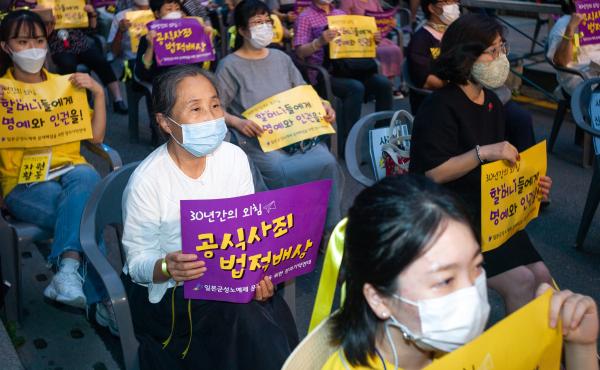 Hundreds of people gather for a rally to mark the International Memorial Day for Comfort Women on August 14, 2020 in Seoul, South Korea. A South Korean court recently ordered Japan to financially compensate 12 women forced into sexual slavery by the Japan Hundreds of people gather for a rally to mark the International Memorial Day for Comfort Women on August 14, 2020 in Seoul, South Korea. A South Korean court recently ordered Japan to financially compensate 12 women forced into sexual slavery by the Japan