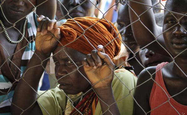In this photo taken Monday, Nov. 14, 2016, women stand outside a U.N. Refugee Agency site in Yei, in southern South Sudan. The formerly peaceful town of Yei is now a center of the renewed civil war. In this photo taken Monday, Nov. 14, 2016, women stand outside a U.N. Refugee Agency site in Yei, in southern South Sudan. The formerly peaceful town of Yei is now a center of the renewed civil war.