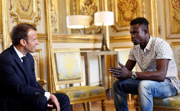 French President Emmanuel Macron speaks with Mamoudou Gassama at the presidential palace in Paris, on Monday. Macron offered Gassama citizenship for his "heroic act" in saving a four-year-old. French President Emmanuel Macron speaks with Mamoudou Gassama at the presidential palace in Paris, on Monday. Macron offered Gassama citizenship for his "heroic act" in saving a four-year-old.