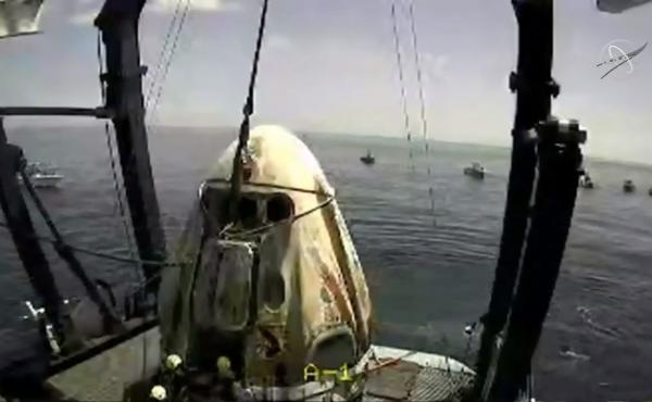 The SpaceX capsule sits aboard a recovery ship in the Gulf of Mexico. The SpaceX capsule sits aboard a recovery ship in the Gulf of Mexico.