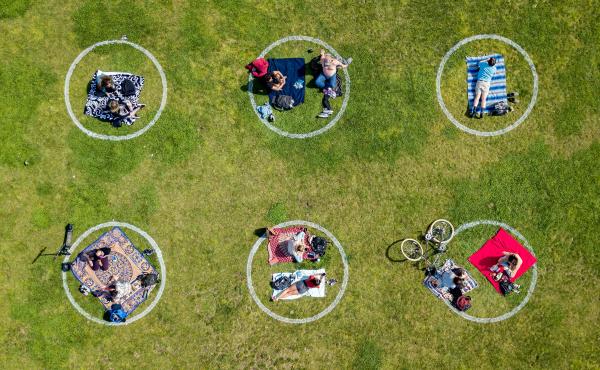 Communication skills used to negotiate safe sex are also useful for setting boundaries while socializing during the COVID-19 pandemic. Above, circles drawn in the grass encourage social distancing at Dolores Park in San Francisco. Communication skills used to negotiate safe sex are also useful for setting boundaries while socializing during the COVID-19 pandemic. Above, circles drawn in the grass encourage social distancing at Dolores Park in San Francisco.