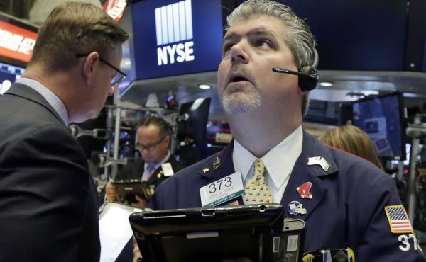 Trader John Panin works on the floor of the New York Stock Exchange on Tuesday. U.S. stock markets fell as U.S.-China trade tensions grew. Trader John Panin works on the floor of the New York Stock Exchange on Tuesday. U.S. stock markets fell as U.S.-China trade tensions grew.