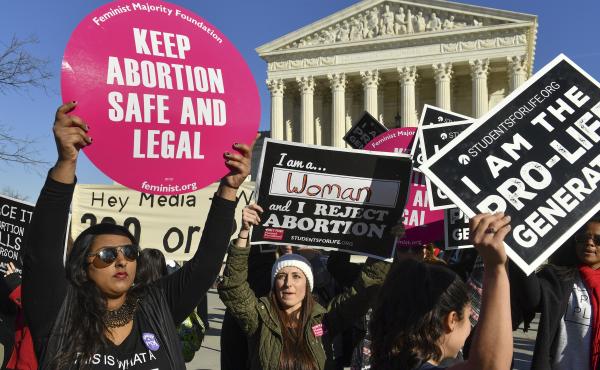 Demonstrators on both sides of the abortion debate rally outside the U.S. Supreme Court on Jan. 19, 2018. Demonstrators on both sides of the abortion debate rally outside the U.S. Supreme Court on Jan. 19, 2018.
