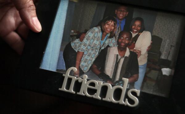 Kelli Glenn holds a photo of her father while he was in the hospital. Kelli Glenn holds a photo of her father while he was in the hospital.