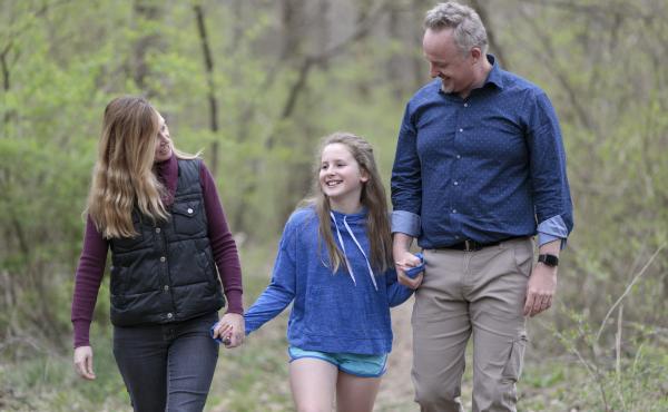 Oakley Yoder walks with her parents, Josh Perry and Shelli Yoder, outside their home in Bloomington, Ind. Oakley Yoder walks with her parents, Josh Perry and Shelli Yoder, outside their home in Bloomington, Ind.
