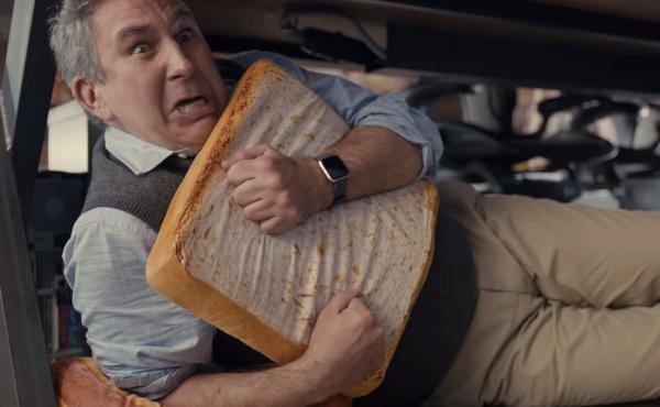 A man cowers under a desk, hugging a pillow shaped like a slice of bread, in a scene from a Little Caesars commercial that ran during the 2020 Super Bowl. A man cowers under a desk, hugging a pillow shaped like a slice of bread, in a scene from a Little Caesars commercial that ran during the 2020 Super Bowl.