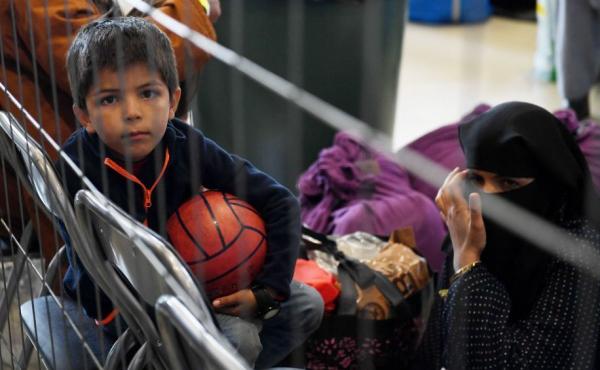 Afghan refugees wait to be processed Sept. 8 inside Hangar 5 at Ramstein Air Base in Germany. Afghan refugees wait to be processed Sept. 8 inside Hangar 5 at Ramstein Air Base in Germany.