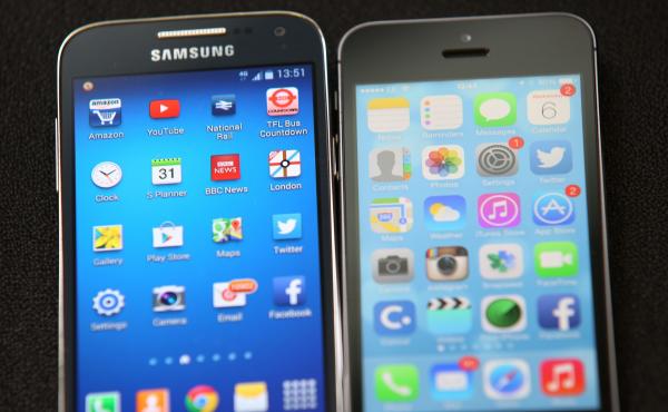 A Samsung and an Apple smartphone are displayed on Aug. 6, 2014, in London. A Samsung and an Apple smartphone are displayed on Aug. 6, 2014, in London.