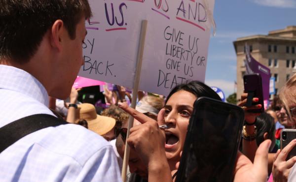 An abortion-rights supporter argues with an anti-abortion-rights protester in front of the U.S. Supreme Court on May 21 during demonstrations in defense of abortion rights. An abortion-rights supporter argues with an anti-abortion-rights protester in front of the U.S. Supreme Court on May 21 during demonstrations in defense of abortion rights.