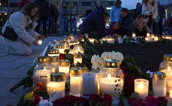 Flowers and candles are placed at the scene of an attack on the square, in Kongsberg, Norway, Thursday. Norwegian authorities say the bow-and-arrow rampage by a man who killed five people in a small town appeared to be a terrorist act. Police identified t Flowers and candles are placed at the scene of an attack on the square, in Kongsberg, Norway, Thursday. Norwegian authorities say the bow-and-arrow rampage by a man who killed five people in a small town appeared to be a terrorist act. Police identified t