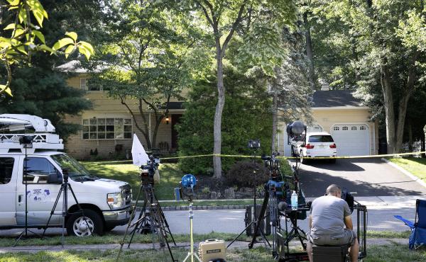 News media set up in front of the home of U.S. District Judge Esther Salas on Monday in North Brunswick, N.J. A gunman posing as a delivery person shot and killed Salas' 20-year-old son Sunday. News media set up in front of the home of U.S. District Judge Esther Salas on Monday in North Brunswick, N.J. A gunman posing as a delivery person shot and killed Salas' 20-year-old son Sunday.