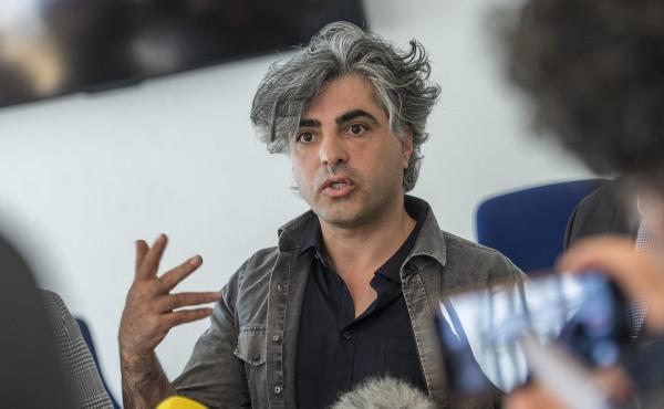 Syrian Oscar-nominated filmmaker Feras Fayyad answers journalists' questions outside a courtroom during a break in a trial against two Syrian defendants accused of state-sponsored torture in Syria, on April 23, in Koblenz, Germany. Syrian Oscar-nominated filmmaker Feras Fayyad answers journalists' questions outside a courtroom during a break in a trial against two Syrian defendants accused of state-sponsored torture in Syria, on April 23, in Koblenz, Germany.