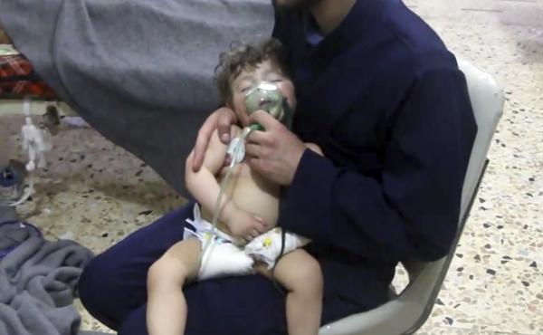 This image made from video shows a medical worker administering oxygen through respirators following an alleged poison gas attack in Douma. The Syrian government denied the allegations. This image made from video shows a medical worker administering oxygen through respirators following an alleged poison gas attack in Douma. The Syrian government denied the allegations.