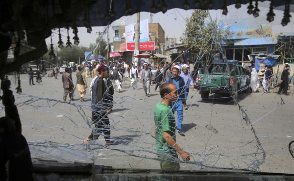 Afghans are seen through a shattered windshield of a bus after an explosion in Kabul, Afghanistan. A suicide car bomber targeted the police headquarters in western Kabul on Wednesday. Afghans are seen through a shattered windshield of a bus after an explosion in Kabul, Afghanistan. A suicide car bomber targeted the police headquarters in western Kabul on Wednesday.