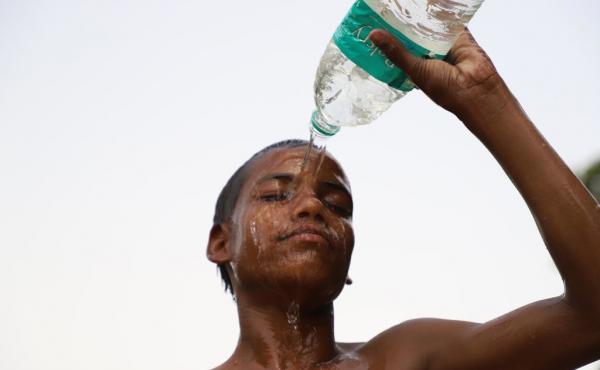 A kid tries to beat the heat in New Delhi on June 15. The changing climate is especially brutal in India. Temperatures are soaring. Asphalt roads are melting. People are dying. A kid tries to beat the heat in New Delhi on June 15. The changing climate is especially brutal in India. Temperatures are soaring. Asphalt roads are melting. People are dying.
