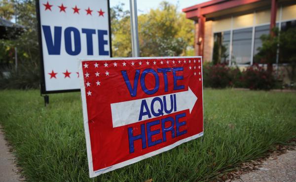 A bilingual sign outside a polling center in Austin, Texas. A bilingual sign outside a polling center in Austin, Texas.