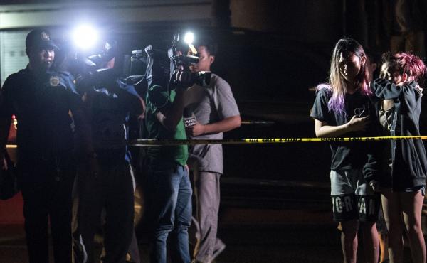Relatives of an alleged drug dealer killed during a police anti-drug operation react upon seeing his body in Manila on Thursday. Police in the Philippine capital shot dead more than two dozen drug suspects in another round of anti-drug raids, authorities Relatives of an alleged drug dealer killed during a police anti-drug operation react upon seeing his body in Manila on Thursday. Police in the Philippine capital shot dead more than two dozen drug suspects in another round of anti-drug raids, authorities