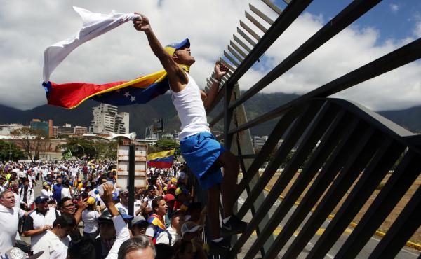 Supporters of Venezuelan opposition leader Juan Guaidó take part in a march in Caracas in February 2019. Amid Venezuela's isolation and catastrophic economic conditions, Guaidó emerged as a key challenger to Nicolás Maduro's rule, but has had difficult Supporters of Venezuelan opposition leader Juan Guaidó take part in a march in Caracas in February 2019. Amid Venezuela's isolation and catastrophic economic conditions, Guaidó emerged as a key challenger to Nicolás Maduro's rule, but has had difficult