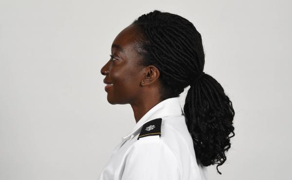 An Army photo shows a soldier wearing a new approved ponytail hairstyle. An Army photo shows a soldier wearing a new approved ponytail hairstyle.