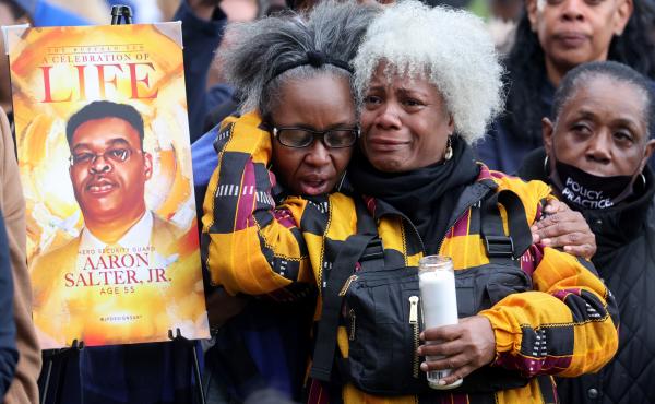 People participate in a vigil to honor the 10 people killed in Saturday's shooting at Tops market in Buffalo, New York. People participate in a vigil to honor the 10 people killed in Saturday's shooting at Tops market in Buffalo, New York.