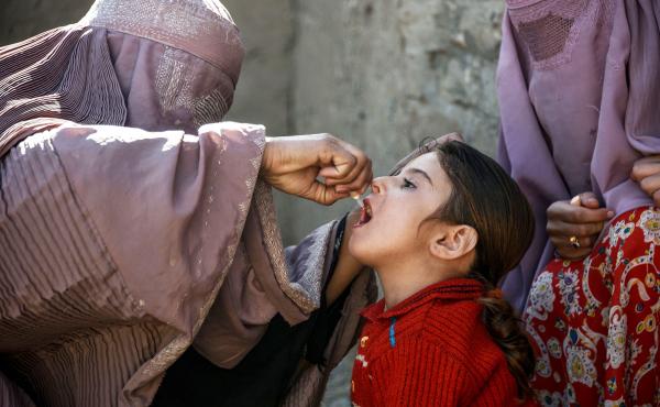 A health worker administers a polio vaccine to a child in Afghanistan's Kandahar province. Taliban opposition to vaccine campaigns have left millions of children unprotected against the virus. A health worker administers a polio vaccine to a child in Afghanistan's Kandahar province. Taliban opposition to vaccine campaigns have left millions of children unprotected against the virus.