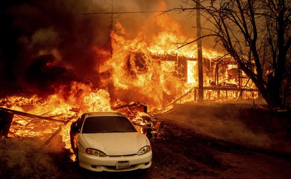 Flames from the Dixie Fire consume a home on Highway 89 south of Greenville, Calif., on Thursday. Flames from the Dixie Fire consume a home on Highway 89 south of Greenville, Calif., on Thursday.