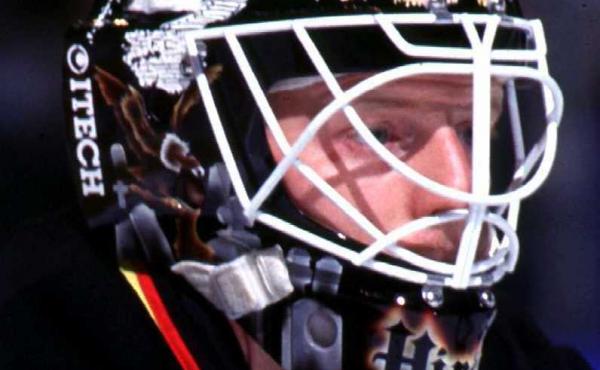 Corey Hirsch, seen during his playing days with the Vancouver Canucks. The mask, which was designed by Frank Cipra and inspired by Psycho, even features Alfred Hitchcock's famous silhouette above Hirsch's eyes. These days, the mask holds special significa Corey Hirsch, seen during his playing days with the Vancouver Canucks. The mask, which was designed by Frank Cipra and inspired by Psycho, even features Alfred Hitchcock's famous silhouette above Hirsch's eyes. These days, the mask holds special significa