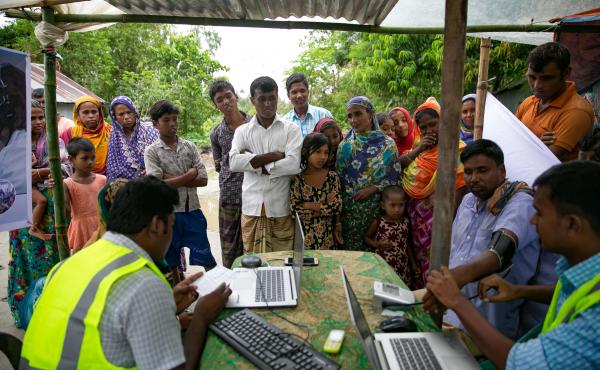 Patients line up for remote health consultation sessions on a remote island near Rangpur, Bangladesh. Patients line up for remote health consultation sessions on a remote island near Rangpur, Bangladesh.