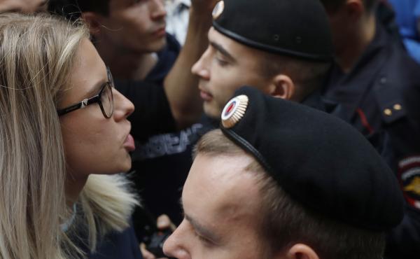 Russian opposition candidate and lawyer Lyubov Sobol stands in front of police during a demonstration in Moscow on July 14. This summer's wave of opposition protests has pushed Sobol to the forefront of the Russian political scene. Russian opposition candidate and lawyer Lyubov Sobol stands in front of police during a demonstration in Moscow on July 14. This summer's wave of opposition protests has pushed Sobol to the forefront of the Russian political scene.