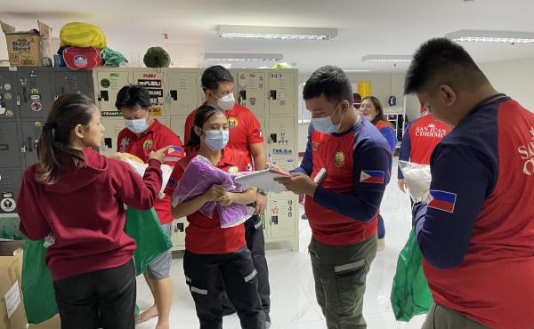 Staffers distribute the required personal protective gear before they transfer a COVID-positive patient to a hospital. They'll wear a gown, gloves, mask and face shield. Staffers distribute the required personal protective gear before they transfer a COVID-positive patient to a hospital. They'll wear a gown, gloves, mask and face shield.