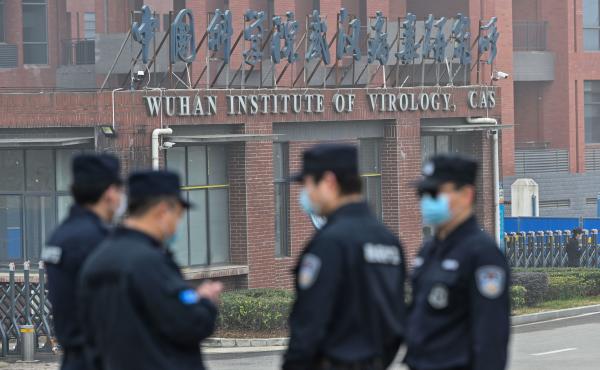 Security personnel stand guard outside the Wuhan Institute of Virology during the Feb. 3 visit of the World Health Organization team investigating the origins of the SARS-CoV-2, the virus that triggered a pandemic. Security personnel stand guard outside the Wuhan Institute of Virology during the Feb. 3 visit of the World Health Organization team investigating the origins of the SARS-CoV-2, the virus that triggered a pandemic.