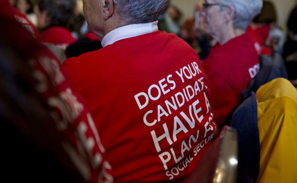 Attendees wear t-shirts in support of presidential candidates committing to Social Security for all generations during a town hall meeting in Cedar Rapids, Iowa, on Jan. 29. Attendees wear t-shirts in support of presidential candidates committing to Social Security for all generations during a town hall meeting in Cedar Rapids, Iowa, on Jan. 29.
