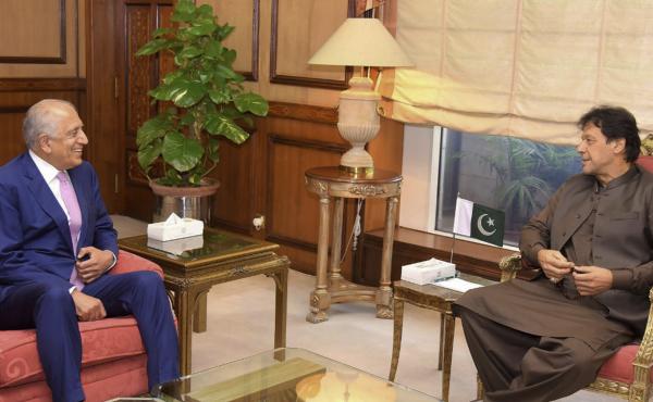 Pakistan's Prime Minister Imran Khan meets U.S. Special Envoy Zalmay Khalilzad (left) in Islamabad on Aug. 1. Khalilzad met Khan ahead of peace talks in Qatar with the Taliban. Pakistan's Prime Minister Imran Khan meets U.S. Special Envoy Zalmay Khalilzad (left) in Islamabad on Aug. 1. Khalilzad met Khan ahead of peace talks in Qatar with the Taliban.
