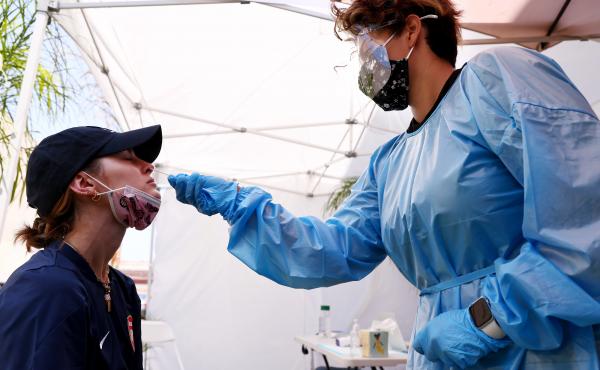 A medical assistant administers a coronavirus test last week in Los Angeles. COVID-19 cases are on the rise as the highly transmissible delta variant has become the dominant coronavirus strain in the United States. A medical assistant administers a coronavirus test last week in Los Angeles. COVID-19 cases are on the rise as the highly transmissible delta variant has become the dominant coronavirus strain in the United States.