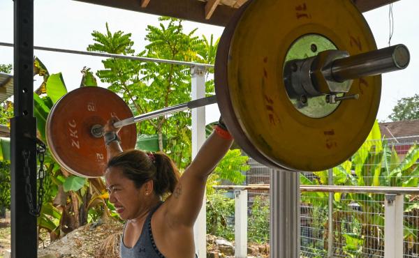Hidilyn Diaz of the Philippines lifts weights during a training session on May 21 in the Malaysian city of Malacca. She had been stuck in Malaysia because of the pandemic. Hidilyn Diaz of the Philippines lifts weights during a training session on May 21 in the Malaysian city of Malacca. She had been stuck in Malaysia because of the pandemic.