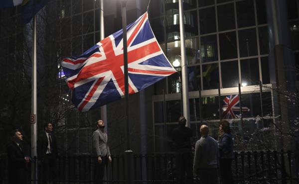 Officials lower and remove the Union Jack from the European Parliament building in Brussels on Friday. As the U.K. prepared to bring to an end its decades-long membership in the European Union, the bloc's top officials on Friday pledged to continue playin Officials lower and remove the Union Jack from the European Parliament building in Brussels on Friday. As the U.K. prepared to bring to an end its decades-long membership in the European Union, the bloc's top officials on Friday pledged to continue playin