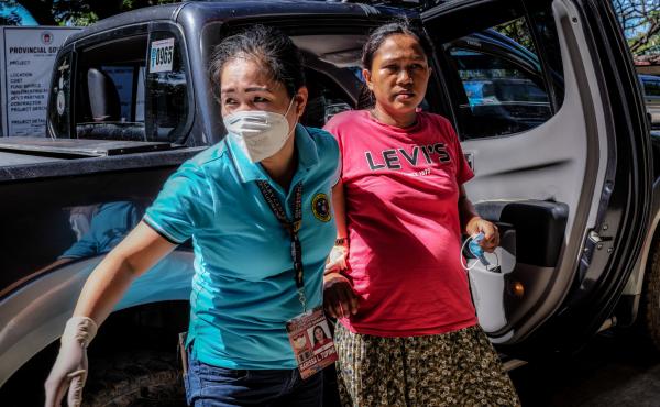 Marissa Tuping, a rural midwife, and Risa Calibuso, right, arrive in Nueva Vizcaya Provincial Hospital on July 21. Calibuso gave birth to her son moments later. Marissa Tuping, a rural midwife, and Risa Calibuso, right, arrive in Nueva Vizcaya Provincial Hospital on July 21. Calibuso gave birth to her son moments later.