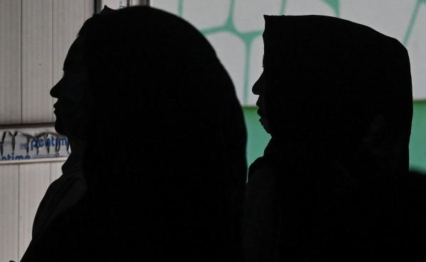 Afghan women gather to protest claims of human rights violations of women by the Taliban regime. Afghan women gather to protest claims of human rights violations of women by the Taliban regime.