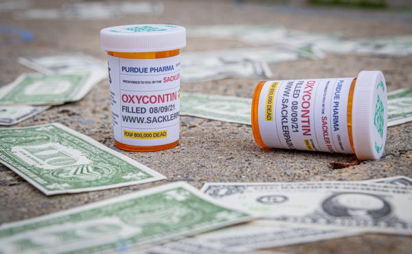 Demonstrators scattered fake money and prescription bottles of OxyContin outside of The United States Bankruptcy Court in response to the overdose crisis. Demonstrators scattered fake money and prescription bottles of OxyContin outside of The United States Bankruptcy Court in response to the overdose crisis.