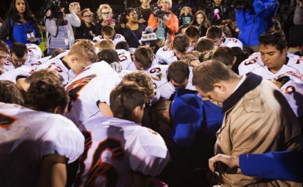 The parties included this image of Coach Kennedy, praying with the crowd after the homecoming game, in their joint appendix submitted to the Supreme Court. The parties included this image of Coach Kennedy, praying with the crowd after the homecoming game, in their joint appendix submitted to the Supreme Court.