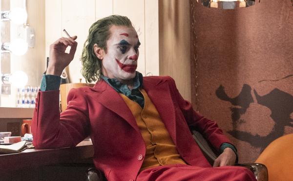 Joaquin Phoenix is Arthur Fleck, a party clown and aspiring stand-up comic who struggles with mental illness and turns violent in Joker. Joaquin Phoenix is Arthur Fleck, a party clown and aspiring stand-up comic who struggles with mental illness and turns violent in Joker.
