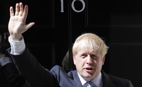 Boris Johnson waves outside 10 Downing Street in London on Wednesday. The polarizing and showboating new prime minister has vowed to deliver on the U.K. leaving the European Union in October, whether or not a deal is reached. Boris Johnson waves outside 10 Downing Street in London on Wednesday. The polarizing and showboating new prime minister has vowed to deliver on the U.K. leaving the European Union in October, whether or not a deal is reached.