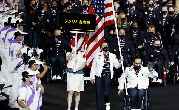 Flag bearers Melissa Stockwell and Charles Aoki of Team USA lead their delegation in the parade of athletes during the opening ceremony of the Tokyo 2020 Paralympic Games on August 24, 2021 in Tokyo, Japan. Flag bearers Melissa Stockwell and Charles Aoki of Team USA lead their delegation in the parade of athletes during the opening ceremony of the Tokyo 2020 Paralympic Games on August 24, 2021 in Tokyo, Japan.