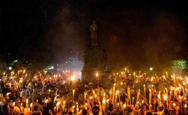 Neo-Nazis, white supremacists and other demonstrators encircle counterprotesters at the base of a statue of Thomas Jefferson on the University of Virginia campus in Charlottesville, Va., on Friday. Neo-Nazis, white supremacists and other demonstrators encircle counterprotesters at the base of a statue of Thomas Jefferson on the University of Virginia campus in Charlottesville, Va., on Friday.